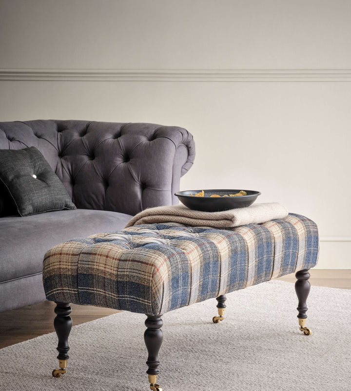 Portland deep buttoned footstool with castors